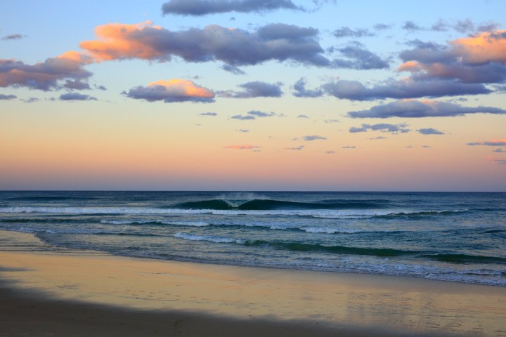 a sunset over a beach